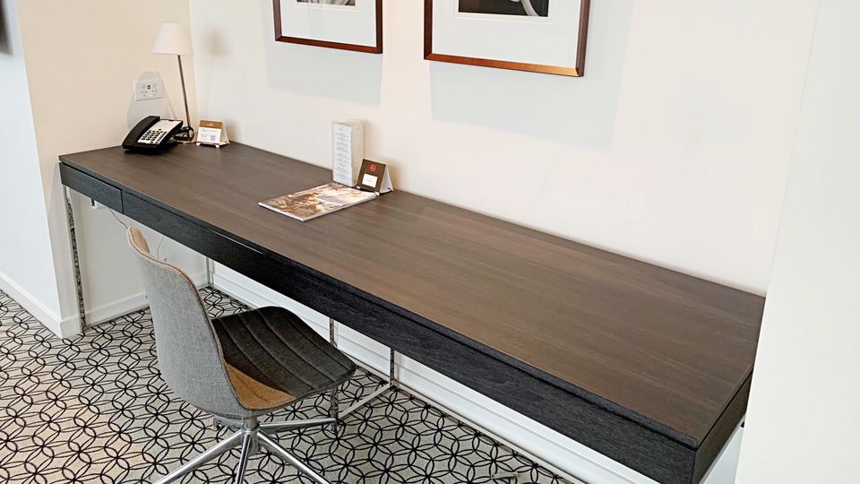 The expansive desk provides plenty of room to spread out your belongings.