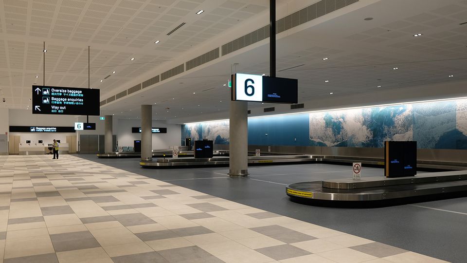 Baggage Hall features a subtle blue color palette, in reference to the coastal location.