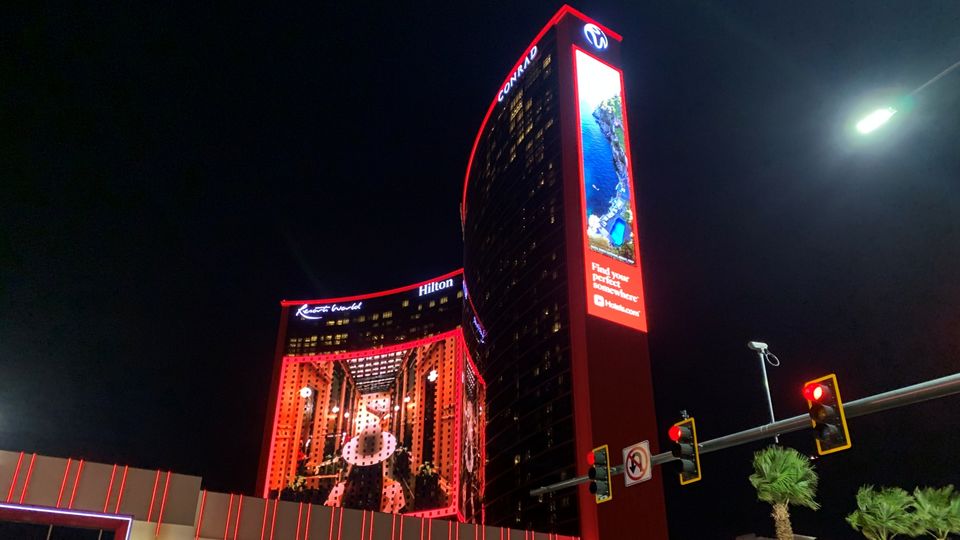 At night, Resorts World casts a red hue over the Strip to compete with its fellow casinos.
