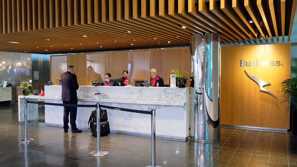 The reception is located at the top of the escalators, overlooking the check-in counters.