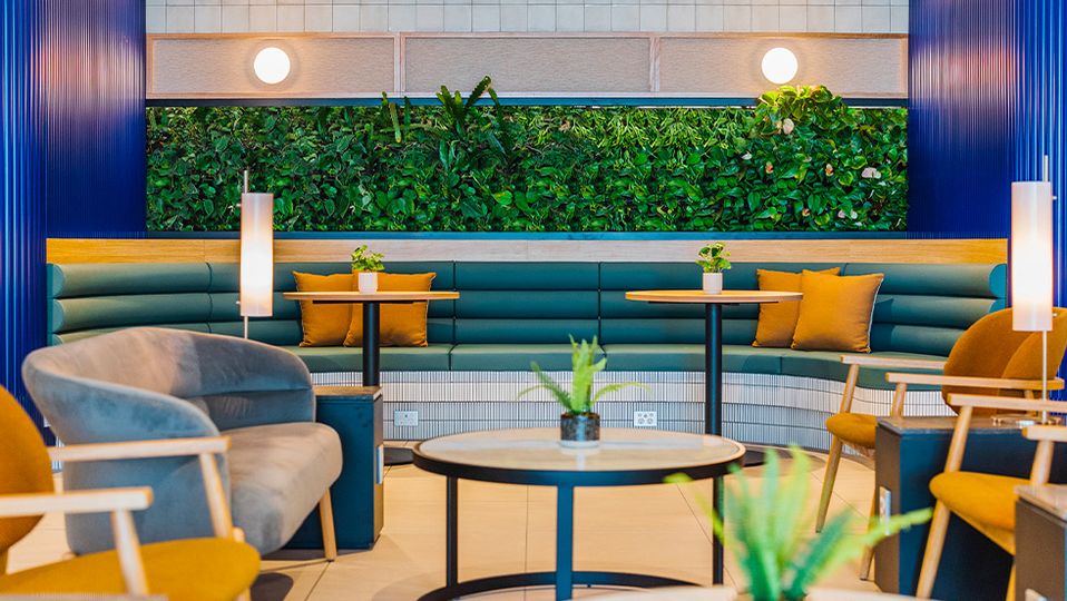 Blue, mustard and emerald tones add some life to the once-dated space.