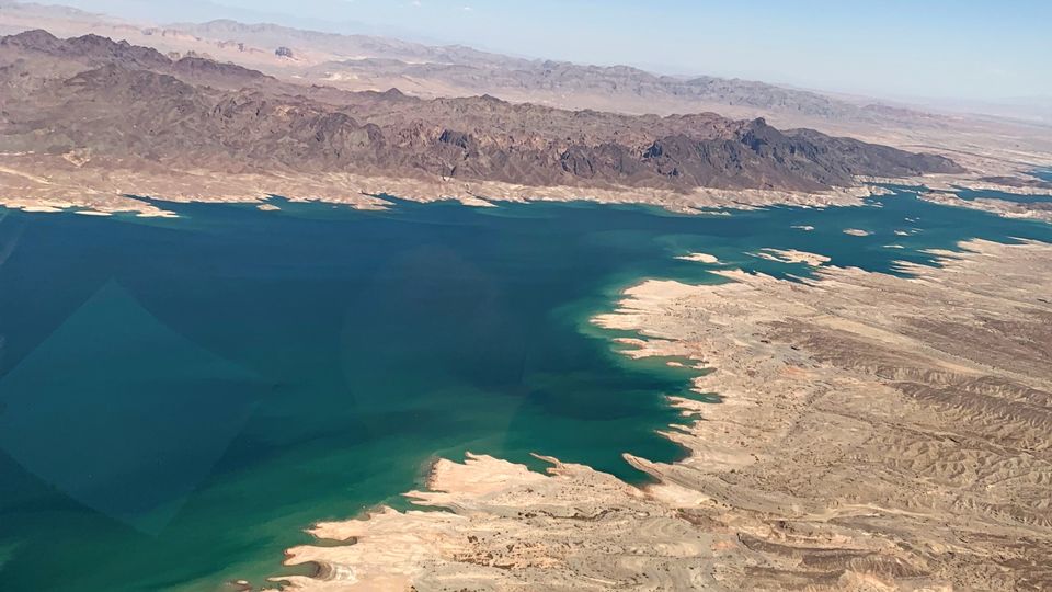 Your return journey will see you fly over Lake Mead, created by the construction of the Hoover Dam.