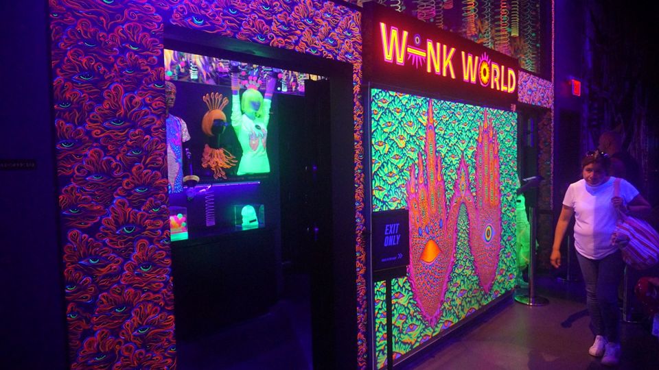 Wink World is a short series of neon exhibits from the mind behind the Blue Man Group.