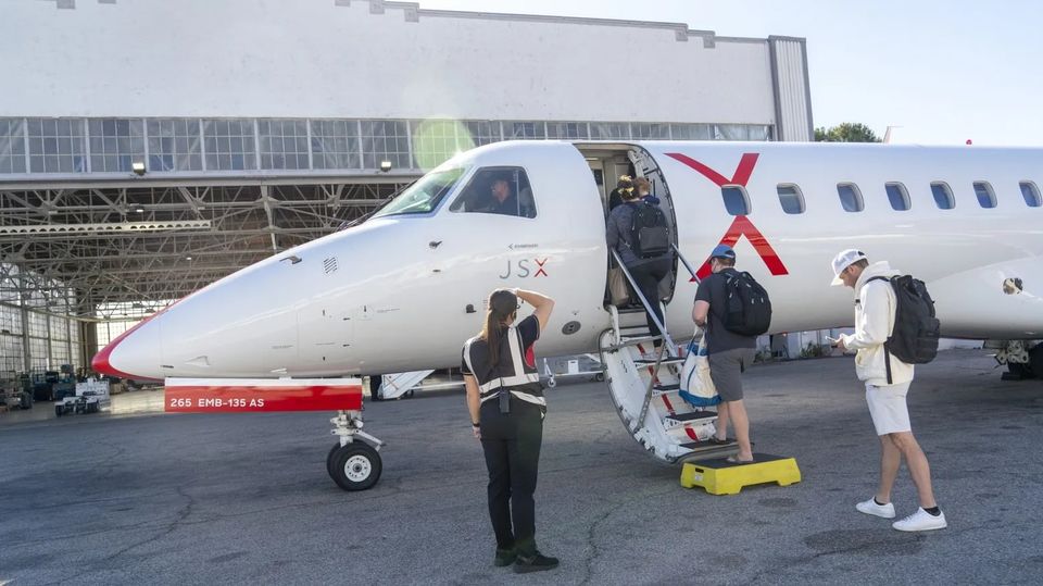 Passengers board a JSX jet at Hollywood Burbank Airport in Burbank, California.