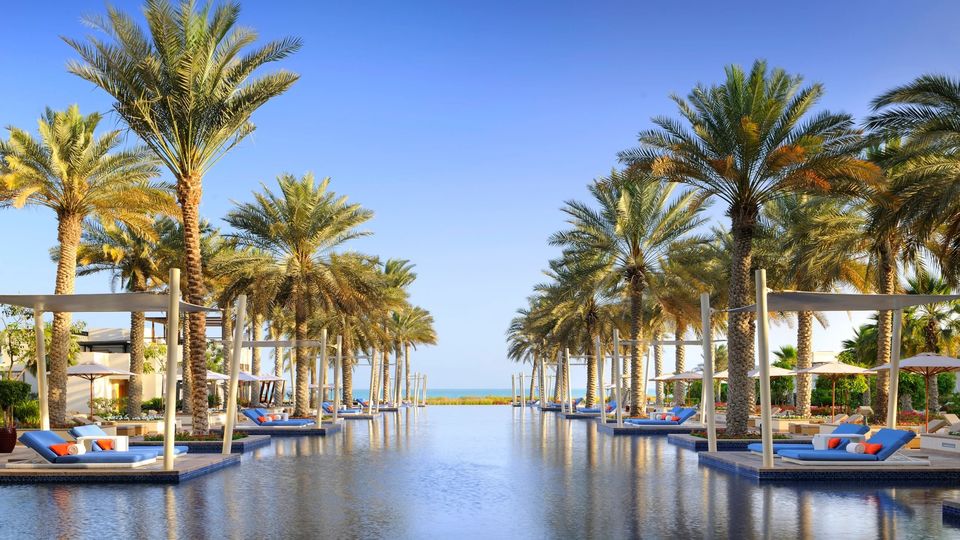 Park Hyatt Abu Dhabi's pool is perfectly landscaped and reflects an ultra-luxe environment.
