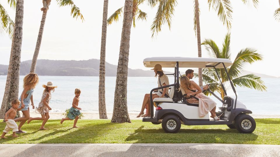 Getting around Hamilton Island is as easy as jumping in a golf cart.