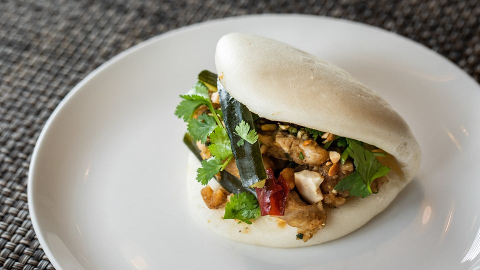 Kung pao chicken bao with Sichuan pepper and cashews.