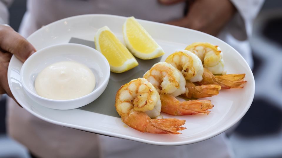 Barbecued prawns with lemon and aioli.