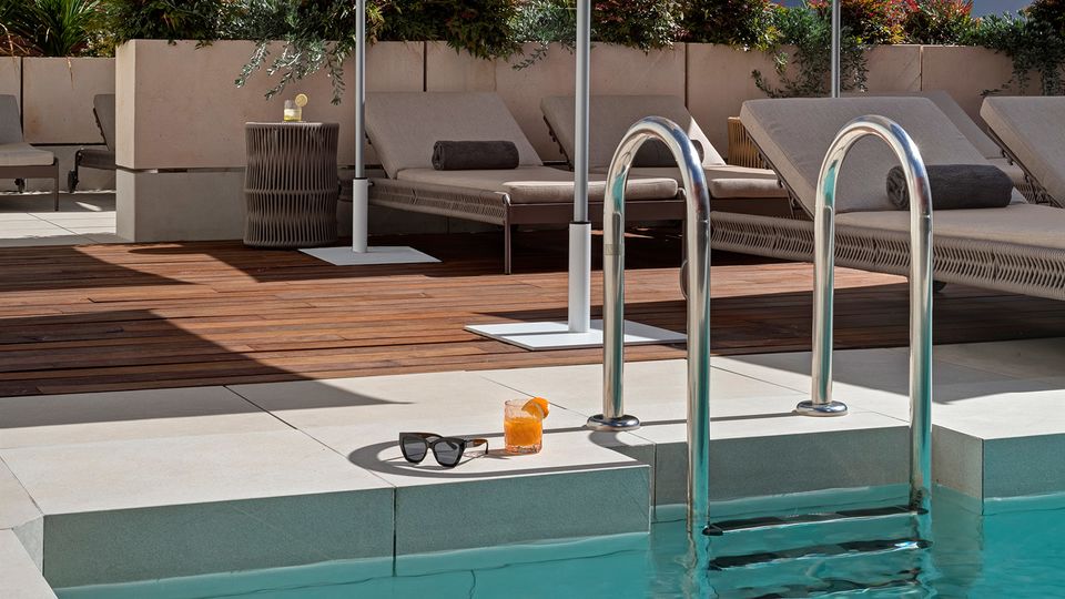 Guests can soak up the sunshine poolside at UMusic Hotel Madrid.