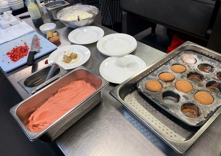 Putting together the brown sugar sponge with strawberry sorbet and vanilla cream.