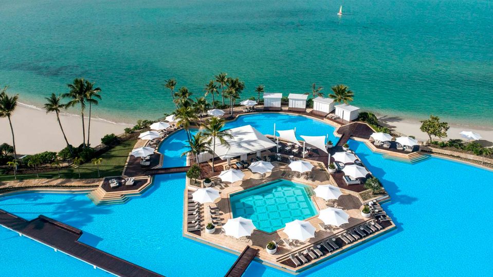 Many rooms enjoy an impressive outlook across the pool to the sea beyond.