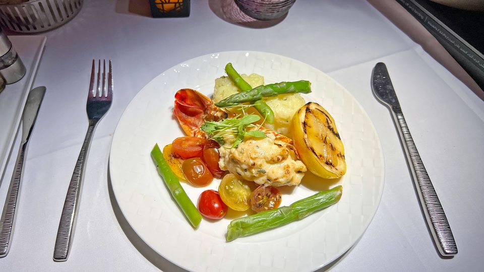 Grilled lemon adds a nice freshness to the rich seafood dish.