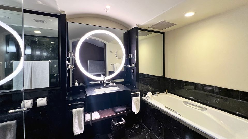 The well-equipped and highly-reflective bathroom is so bright you'll need shades.