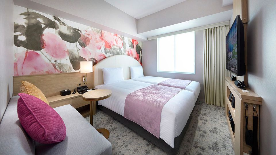 One of the comfortably furnished rooms at Hotel Villa Fontaine Grand.