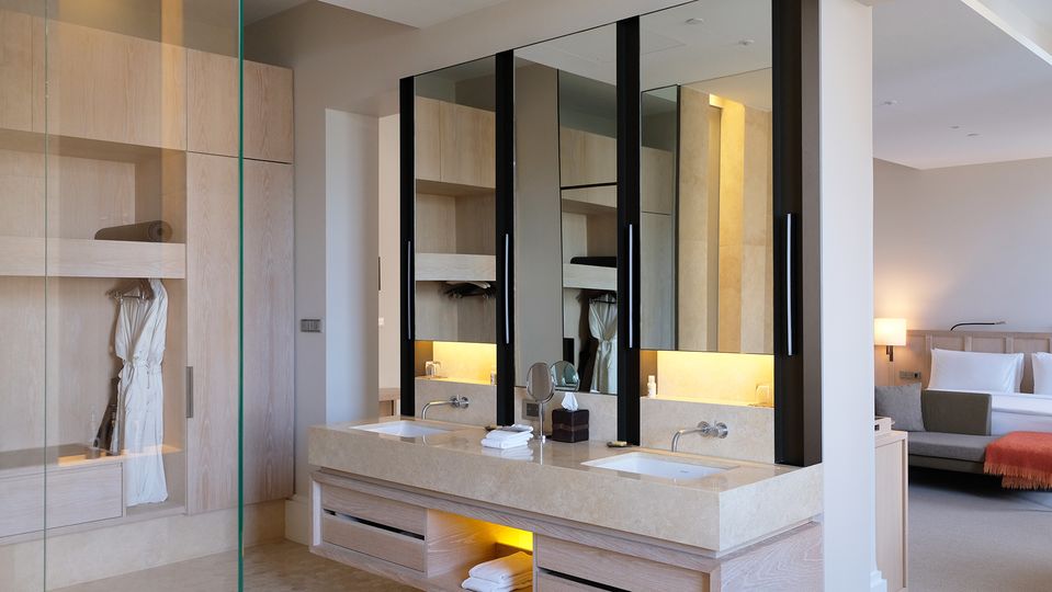 Bath crystals and fragrant pump bottle toiletries add to the spa-like quality of the room.