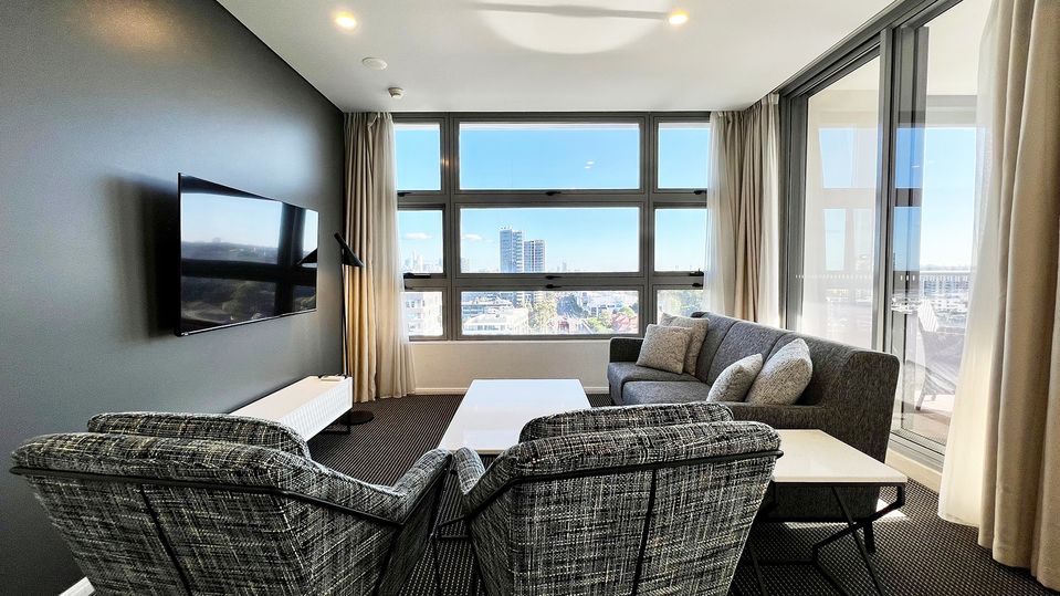 Large windows afford a view towards the Sydney skyline.
