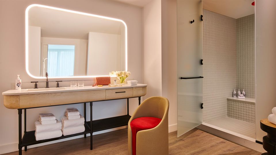 Suites feature a hybrid bathroom and dressing room.