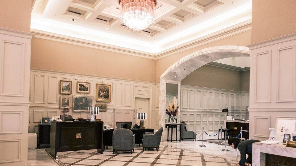 Cascading chandeliers and wainscoting abound in the lobby.