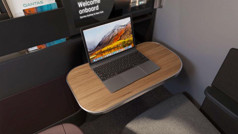 The tray table desk is discreetly tucked away beneath the entertainment screen.