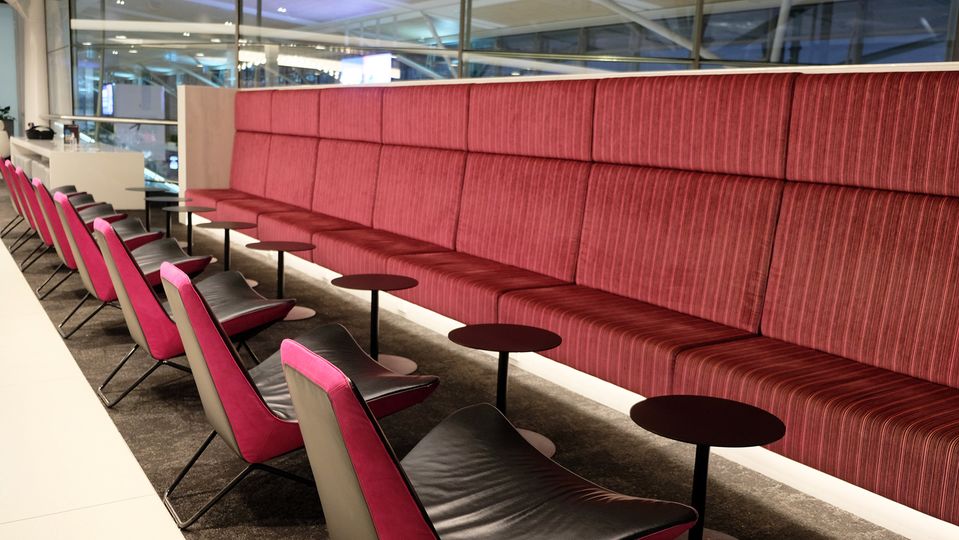 This lengthy maroon lounge makes a fine informal meeting area too.