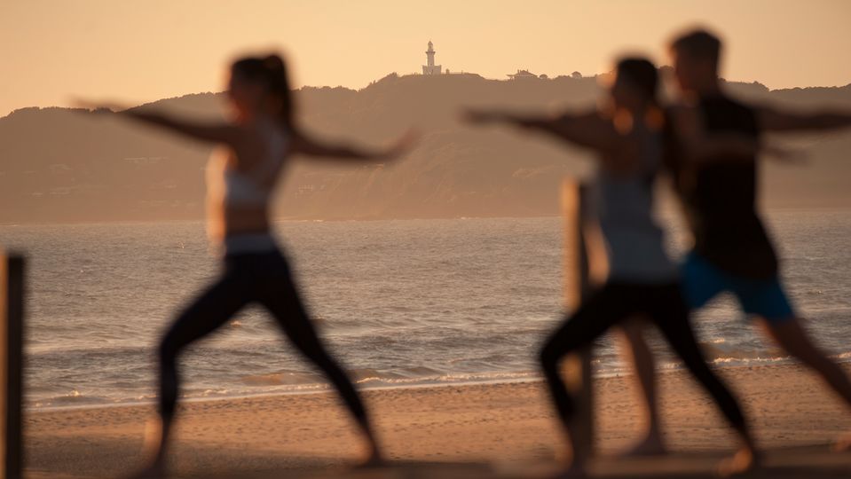 Guests can enjoy sunrise yoga with a view to the Cape Byron Lighthouse.. Destination NSW