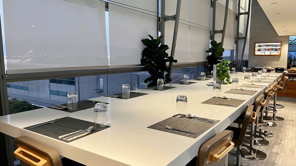 Grab a chair at the main dining table, or find your way to one of the lower tables.
