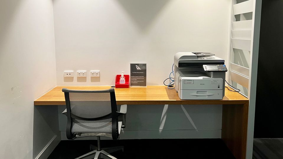 The Business Nook has a single work desk, with reserved seating for VIPs directly behind.