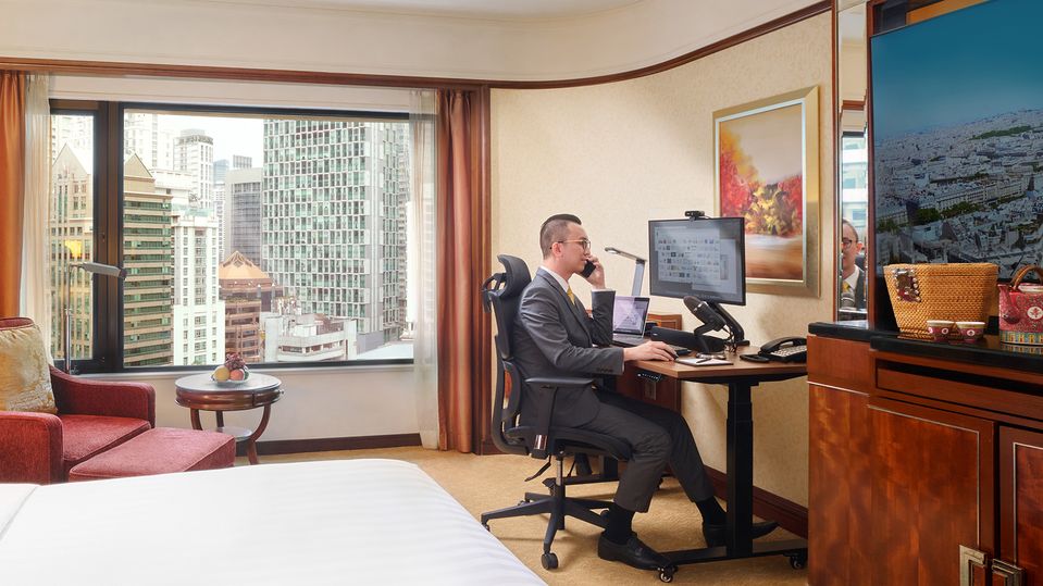 The Shangri-La setup includes an adjustable height 'Omnidesk', monitor, and wireless mouse and keyboard.