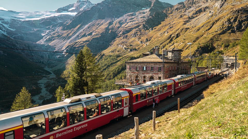 Breathe in the spectacular views of Alp Grum on the Bernina Express.. Switzerland Tourism