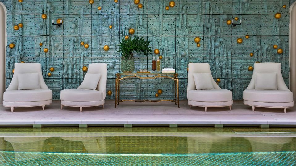 The spa swimming pool is lavishly tiled 17,600 gold scales.