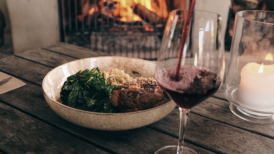 Nothing says winter like a hearty meal and glass of red by the fire.. Allan Scott Bistro