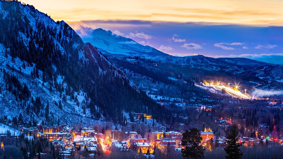 Sunset over Aspen, with the Winter X Games site illuminated in the distance.. Jeremy Swanson