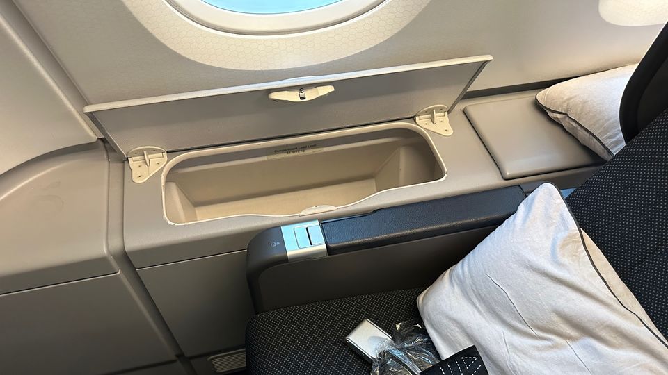 Qantas A380 premium economy storage bins next to the window seats.