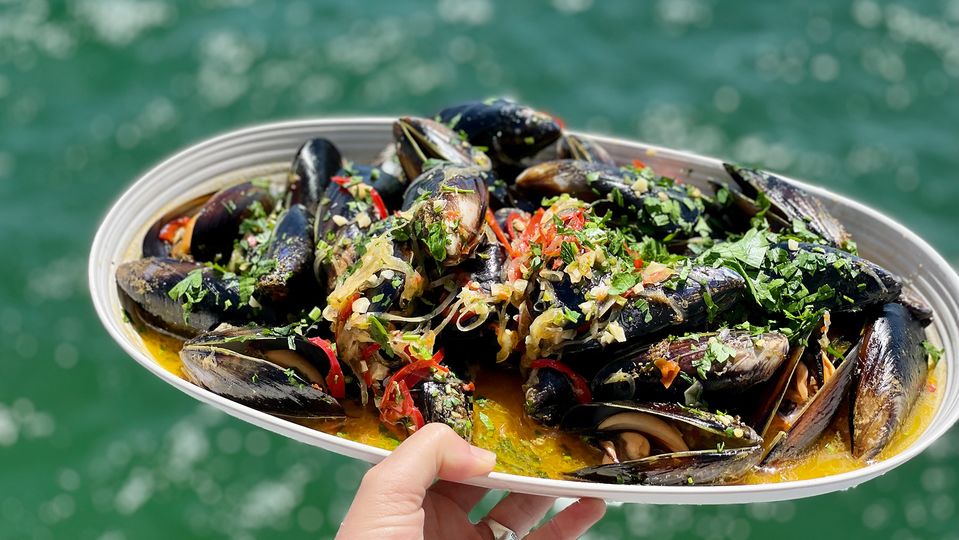 Feast on fresh mussels prepared onboard.