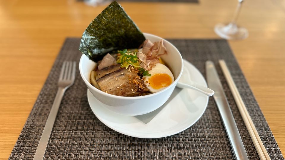 Qantas First Lounge Winter 2023 menu: udon noodles with slow-roasted pork.