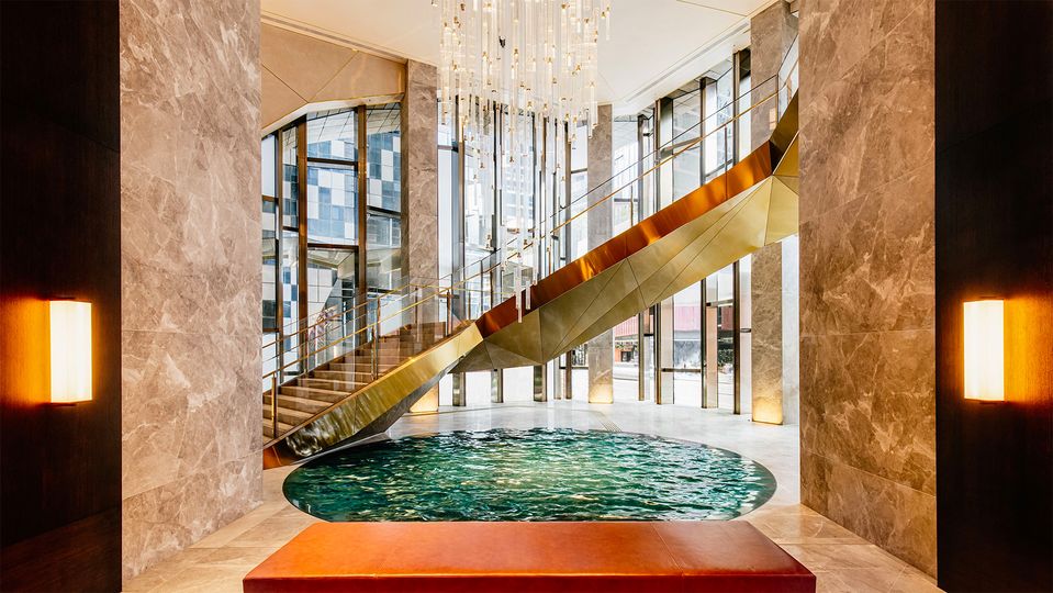 The glittering lobby staircase is just one of the hotel's Insta-worthy sights.
