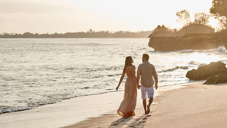 Strolling the beachfront at Raffles Bali.