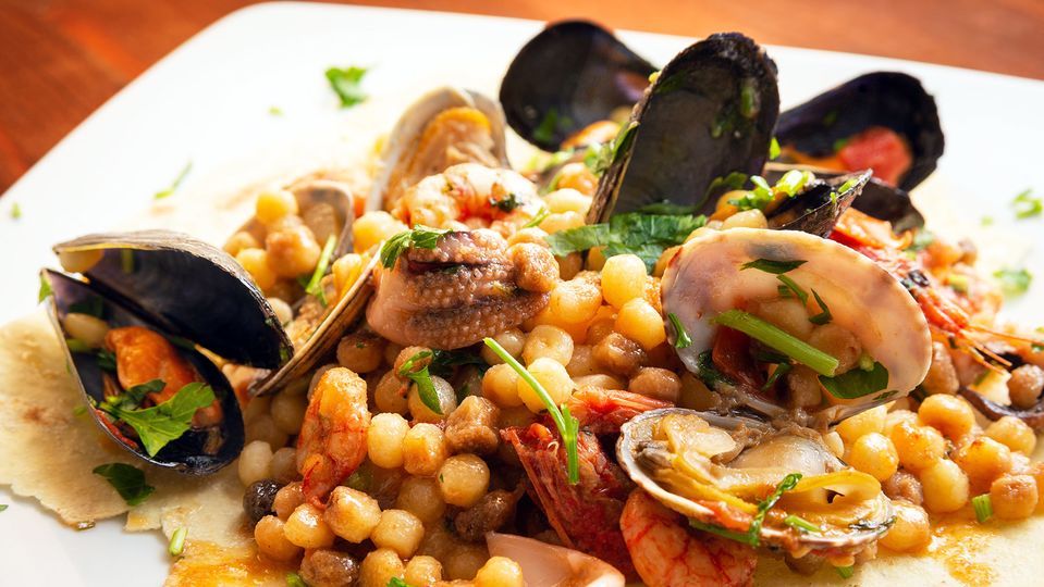 Fresh seafood and fregola, a match made in Sardinian heaven.