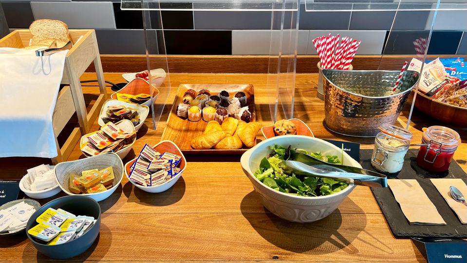 Bread, pastries and an assortment of spreads.