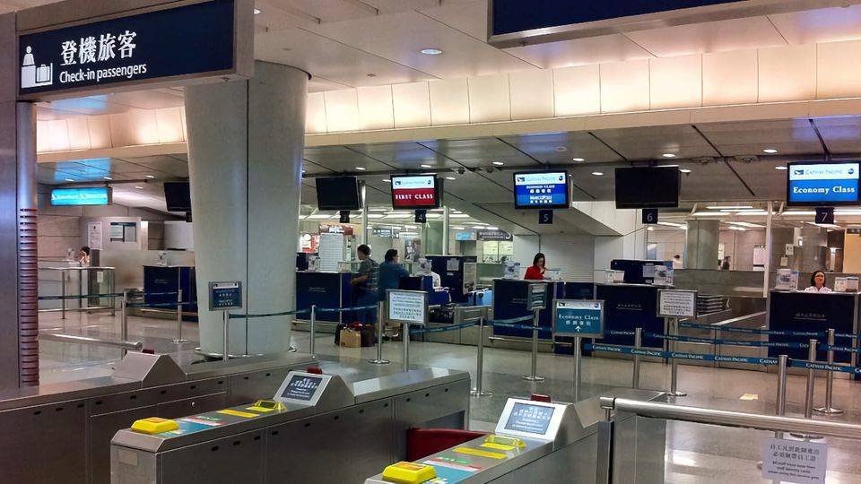 The bag drop and check-in counters of the Hong Kong Airport Express service.