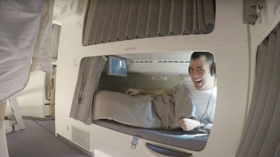 An Emirates crew member relaxing in his A380 bunk.