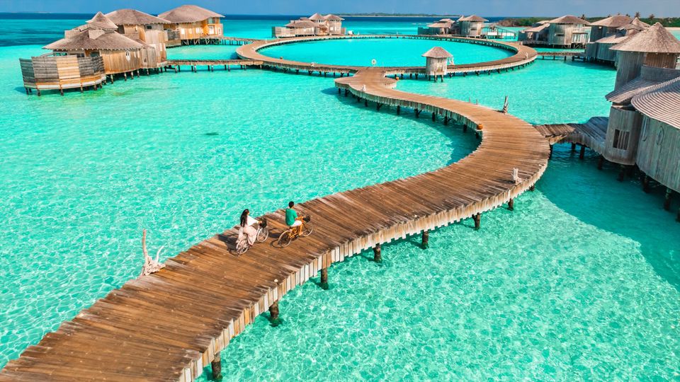Picture yourself cycling from spa treatment to your own overwater bungalow.. Soneva Jani