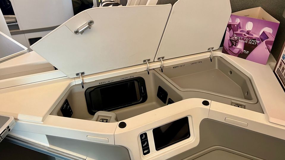 AC and USB power outlets are hidden within the main compartment.