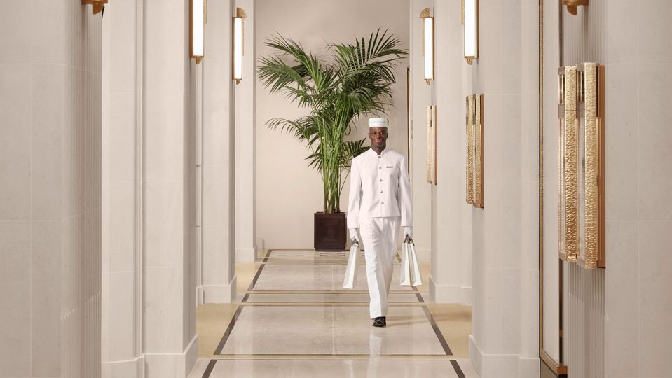 White-clad bell hops are ready to take your bags at The Peninsula London.