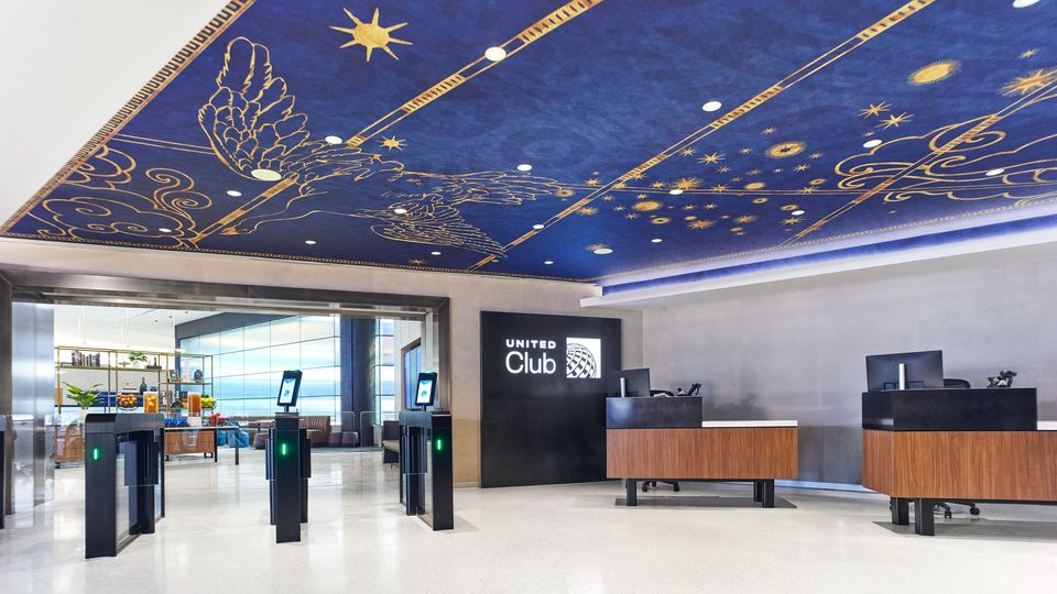 The blue and gold ceiling artwork is inspired by New York's Grand Central Station.