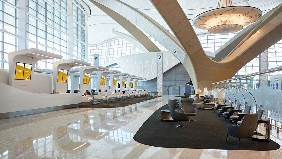 The business check-in area is set beneath the airport's soaring arches.