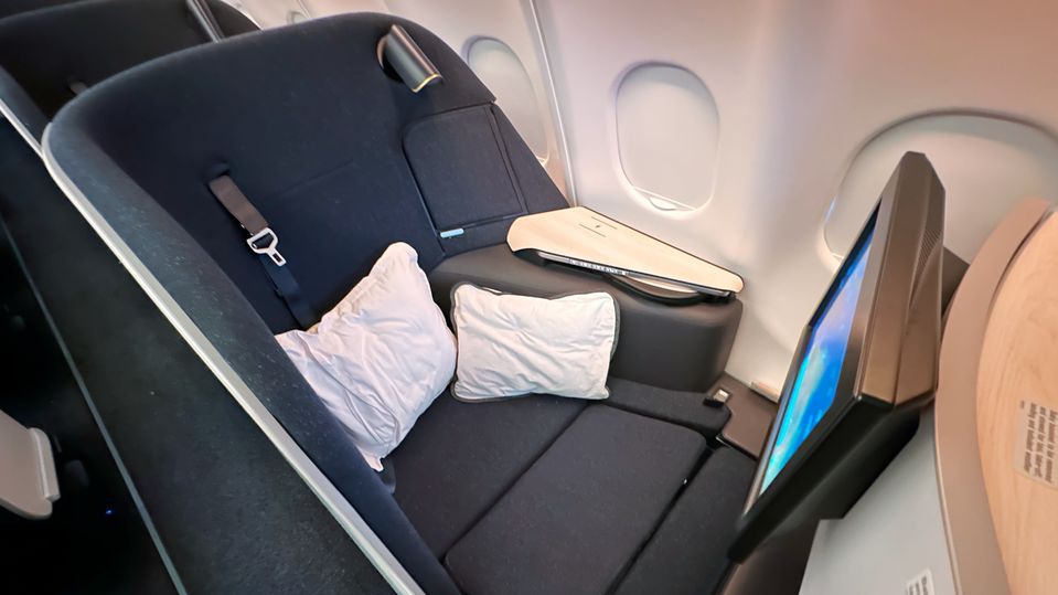 Pillows are your friend for getting comfy when sitting on Finnair's A330 business class.