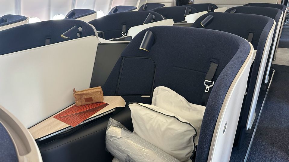 The middle seats of the Qantas Finnair A330 business class cabin.