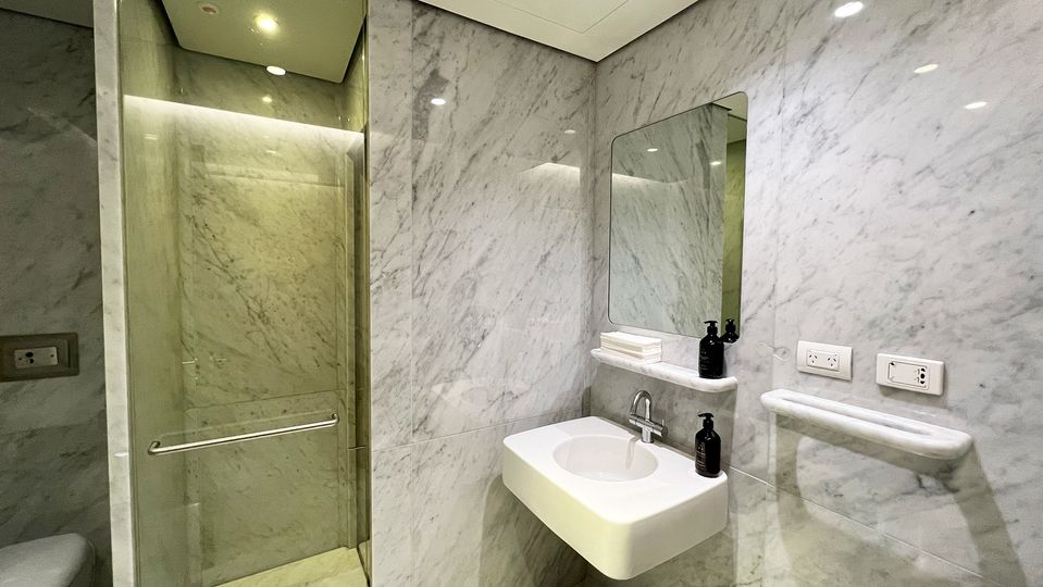 Shower suites are adorned in marble from top to bottom.