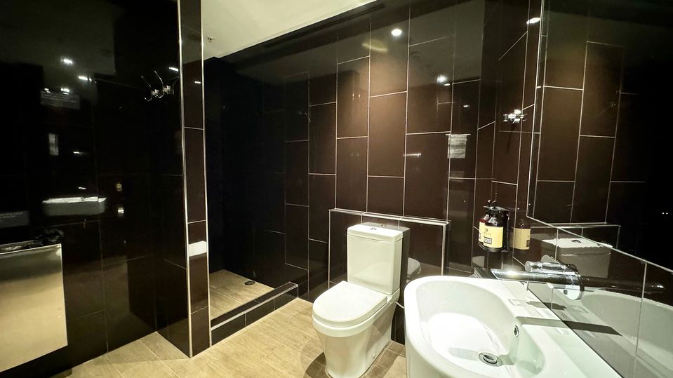 A spacious shower suite stocked with Appelles toiletries.
